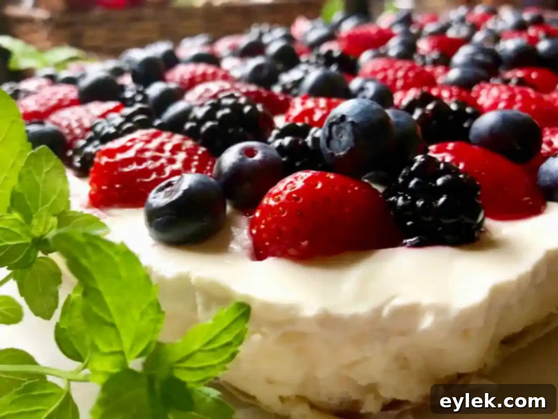 Close-up of fresh mixed berries on cheesecake