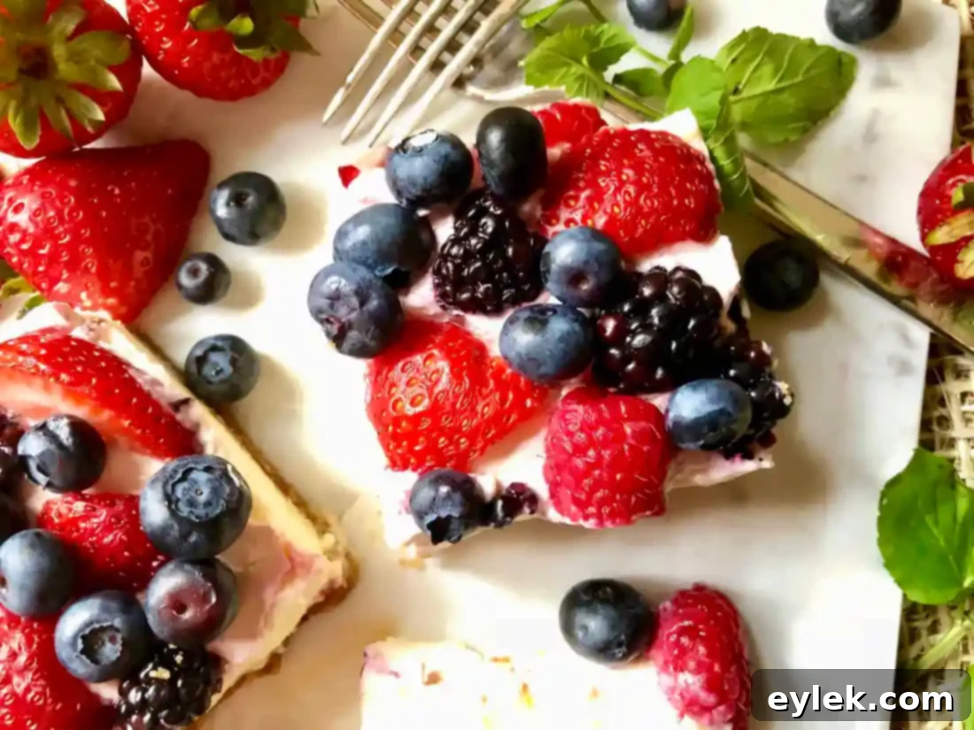 Side view of a slice of berry cheesecake