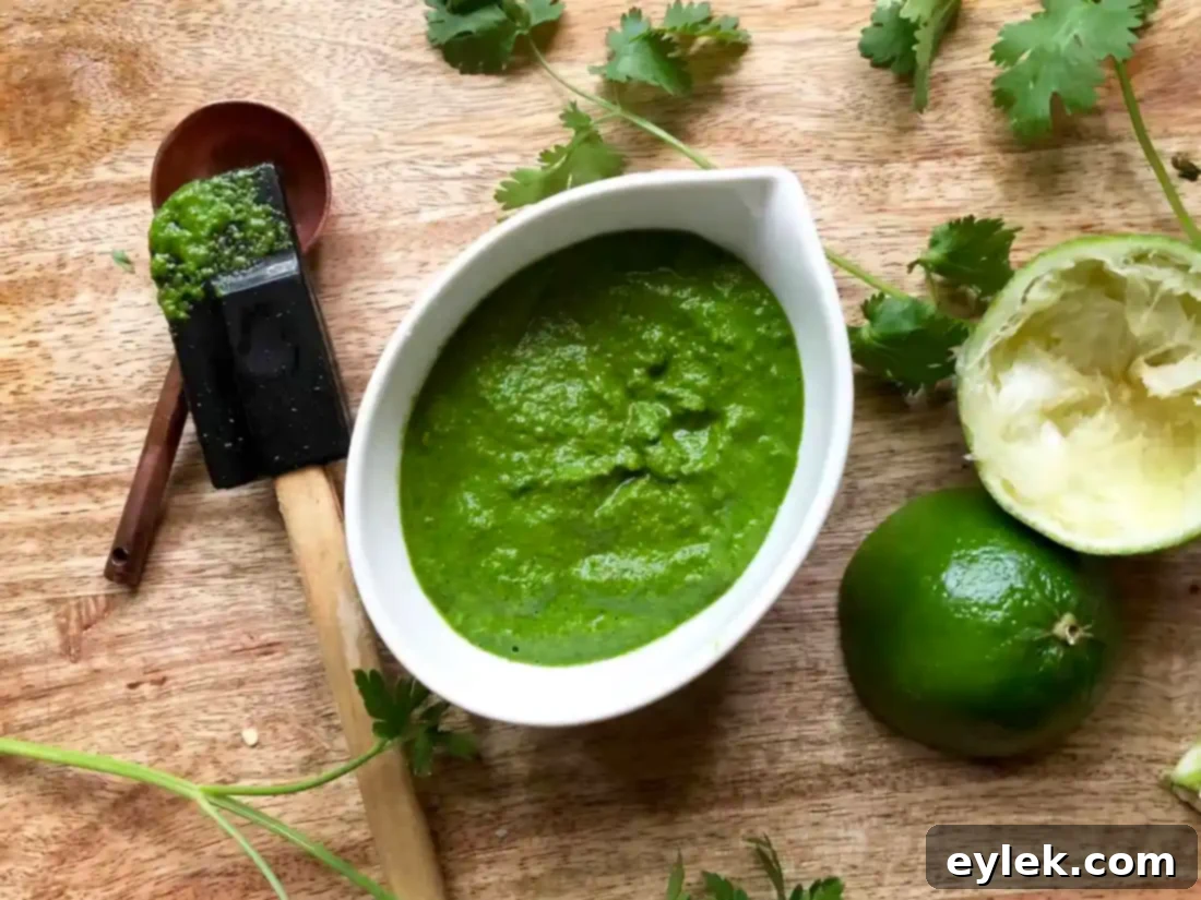 Finished green chile sauce in a glass jar.