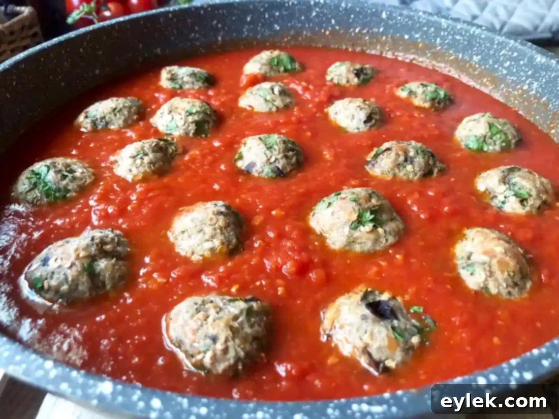 eggplant parmesan meatballs served with pasta