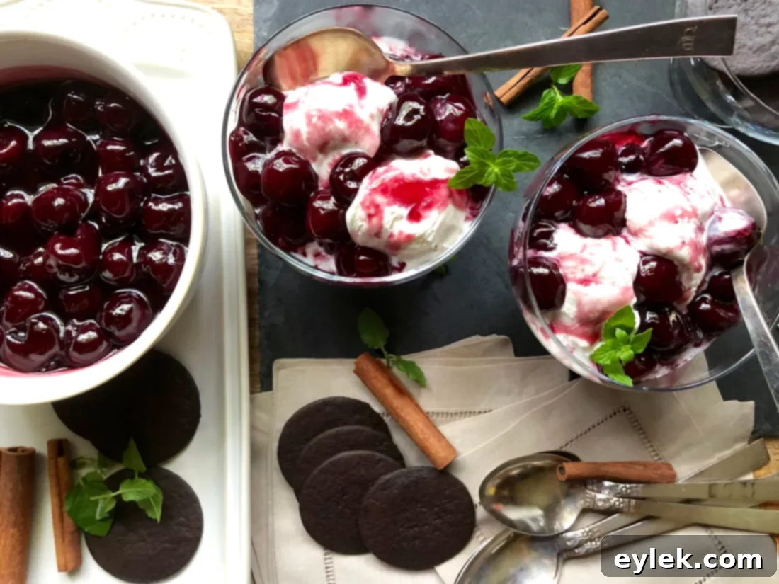 Two bowls of cherry and red wine sundae on a table