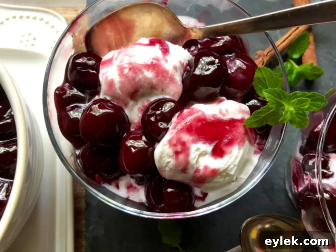 Top-down view of cherry and red wine sundae in a glass bowl