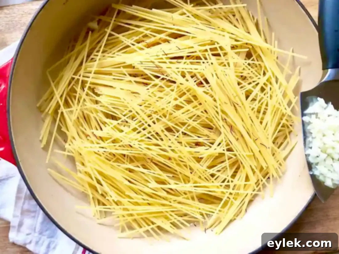 Toasting spaghetti for Pasta Primavera