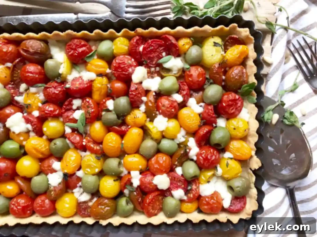 Close-up of Cheesy Tomato & Olive Tart slice