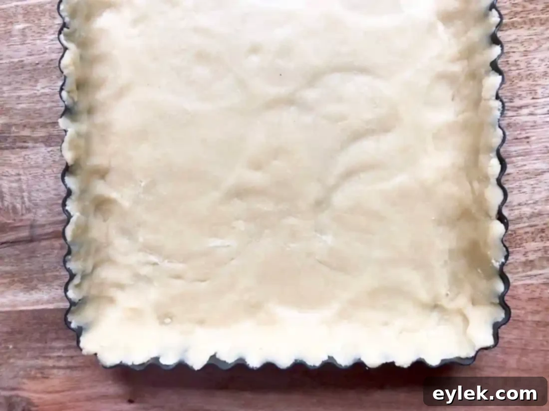 Tart crust lined with foil for blind baking