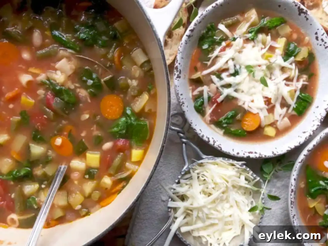 bowl of cheesy garden minestrone with fresh bread