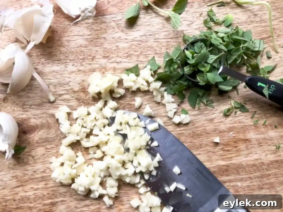 cooking onions and garlic with oregano