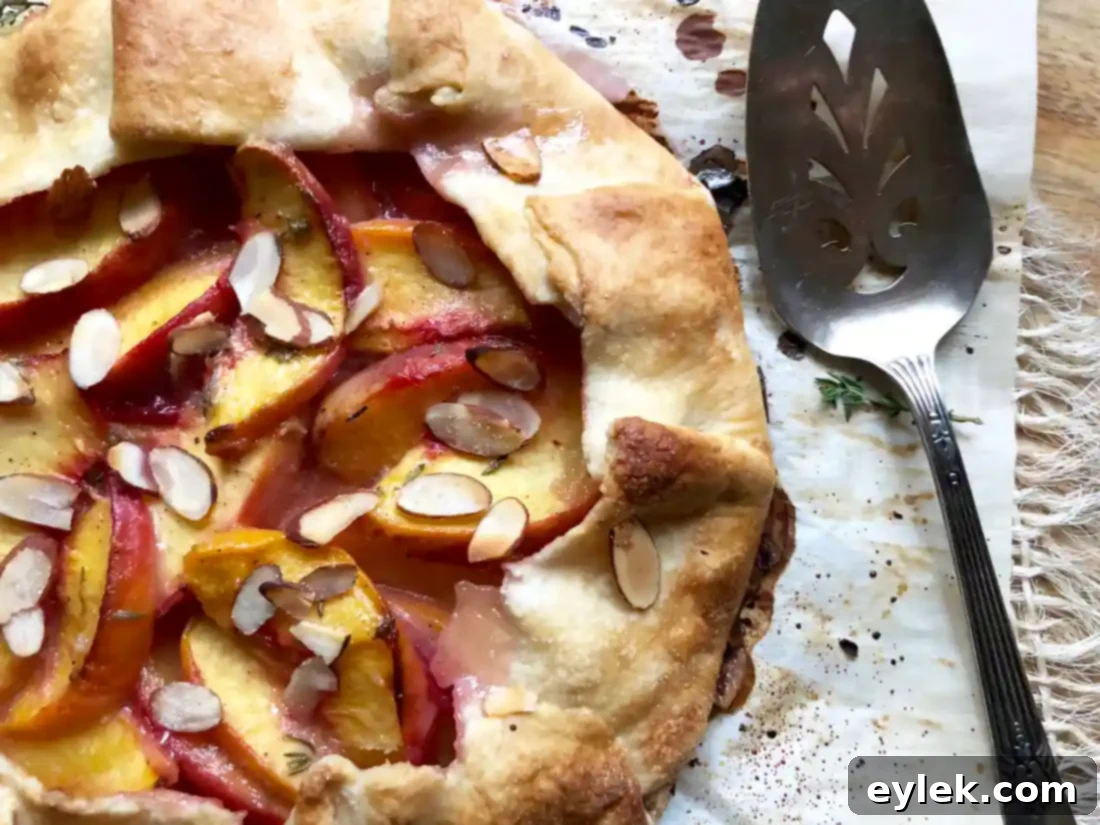 peach tart with scoop of ice cream