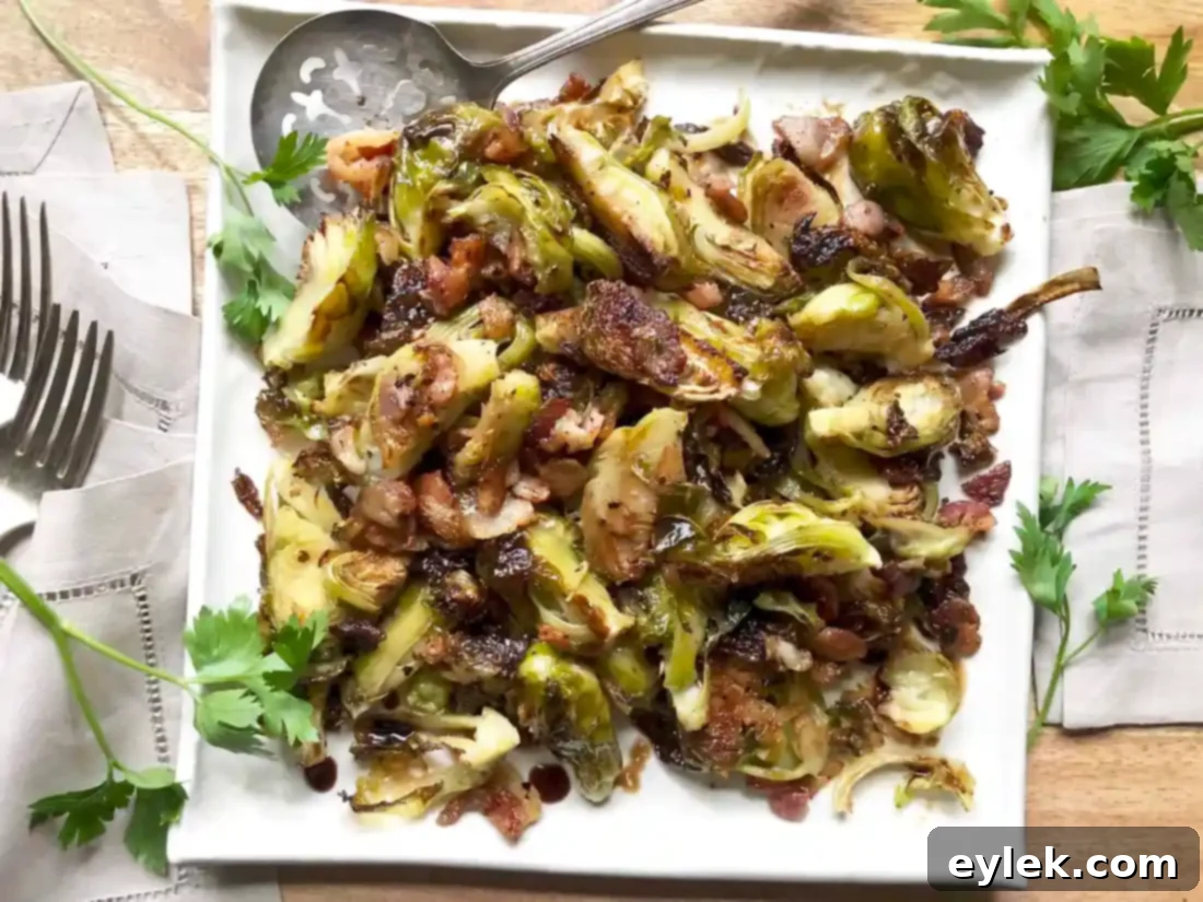 close up of balsamic roasted brussels sprouts with bacon in a bowl, ready to eat