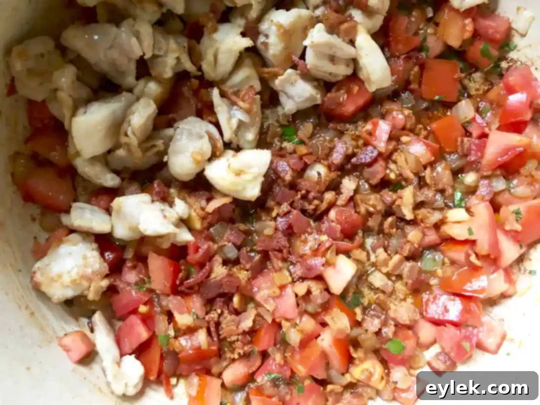 Orzo pasta boiling in Tuscan Chicken & White Bean Soup