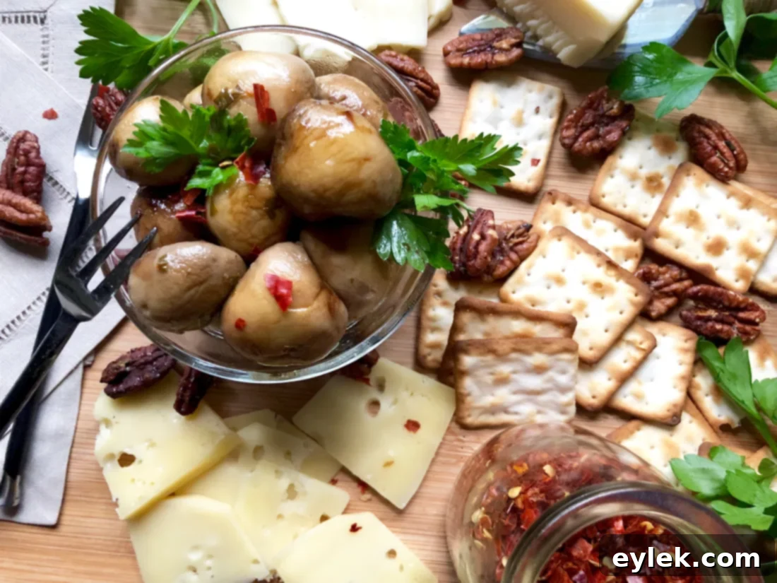 A festive spread featuring marinated mushrooms with balsamic drizzle, cheese, crackers, and other appetizers on a wooden board.