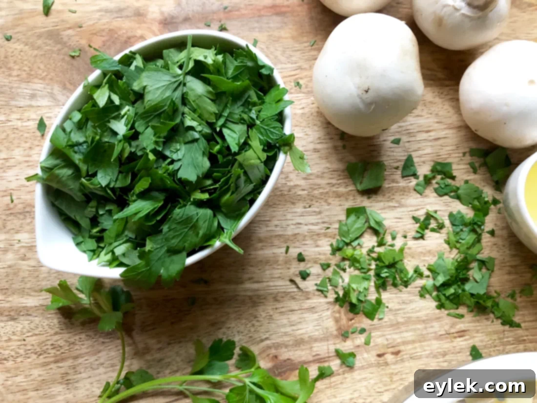 Freshly chopped parsley in a small bowl, ready to be added to the recipe.