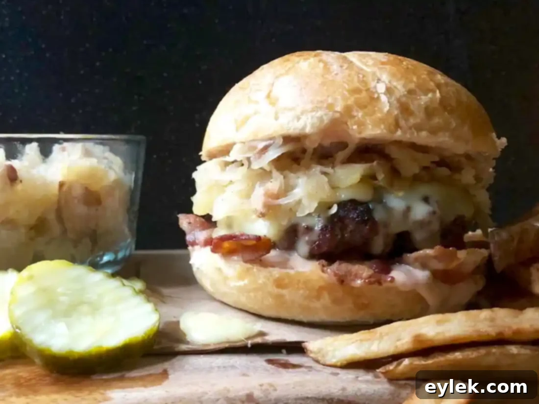 gourmet burger with sauerkraut, bacon, and sautéed apples