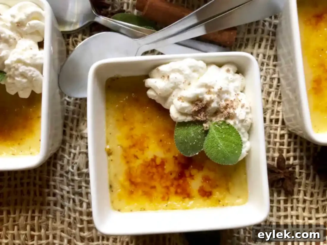 Close-up of pumpkin crème brûlée with nutmeg on whipped cream