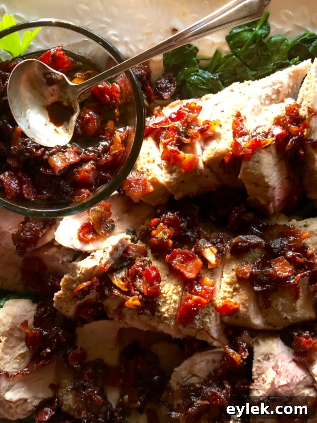 Beautifully plated pork tenderloin with bacon-maple dressing, ready to serve