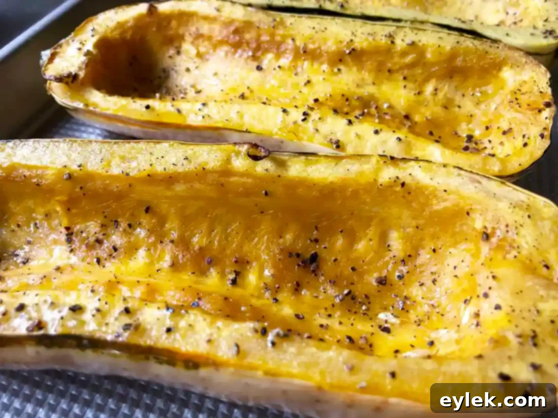 Savory Sausage Stuffed Delicata Squash 6 Close-up of roasted delicata squash, showing tender flesh.