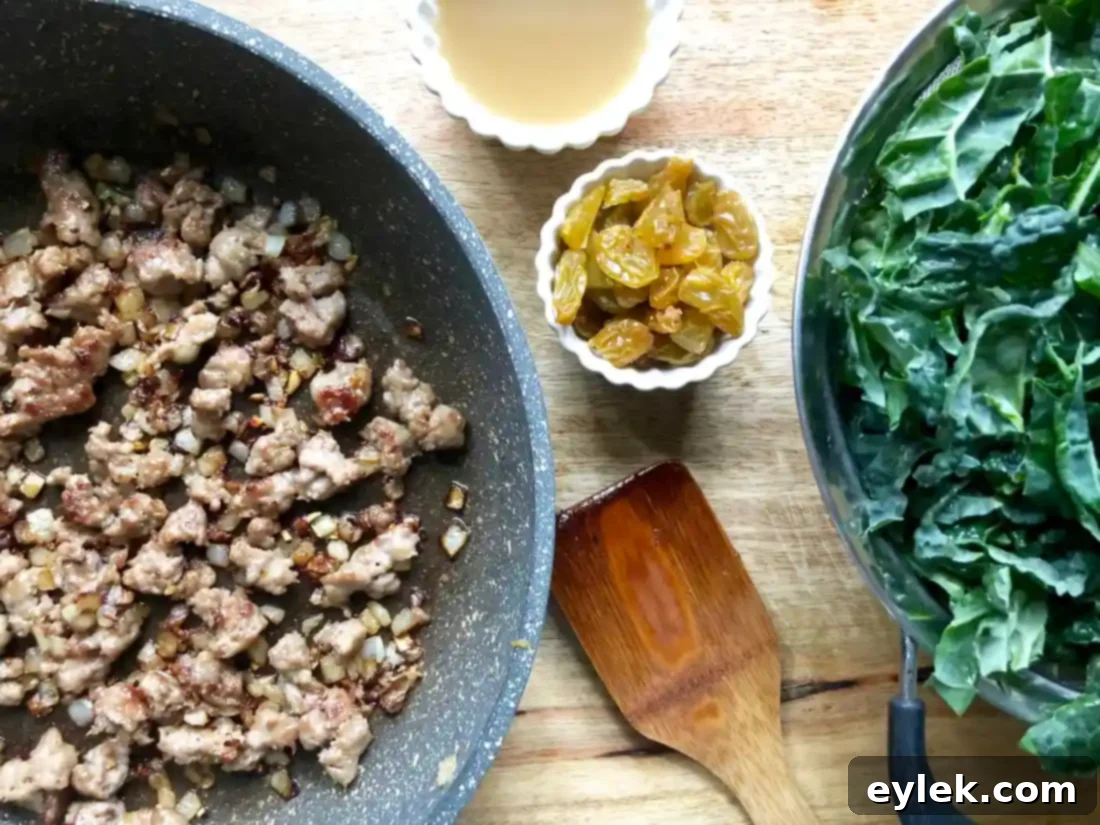Savory Sausage Stuffed Delicata Squash 9 Sausage and kale mixture ready for stuffing.
