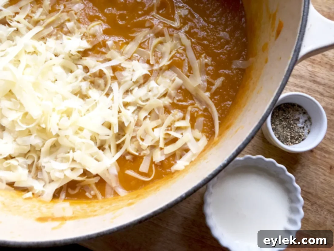 The smooth, creamy pumpkin soup with Gruyere cheese added