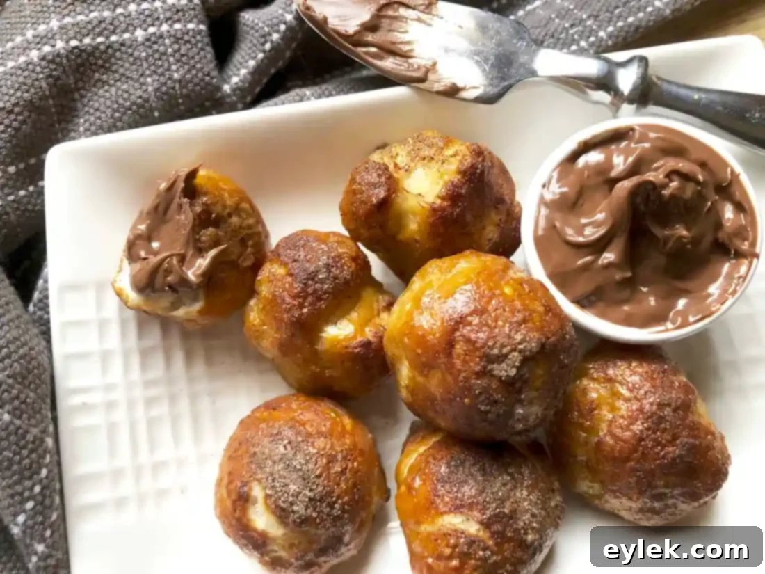 Sweet pretzel bites coated with cinnamon sugar, served with Nutella