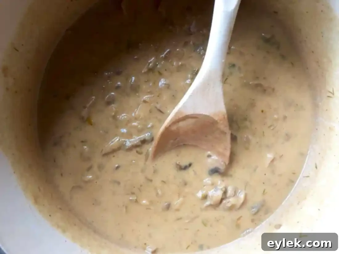 The creamy, thick Hungarian mushroom soup simmering to perfection.