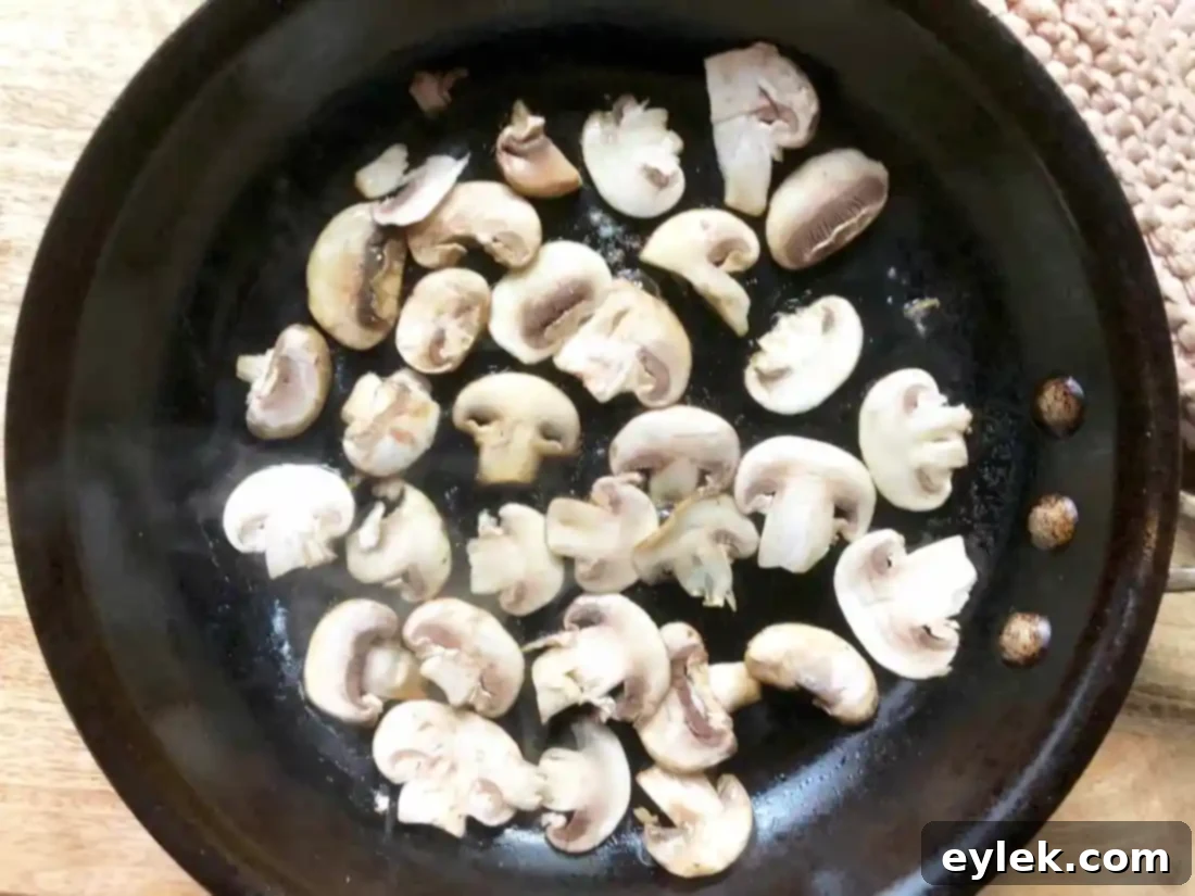 Sautéed mushrooms, seasoned and ready for garnish.