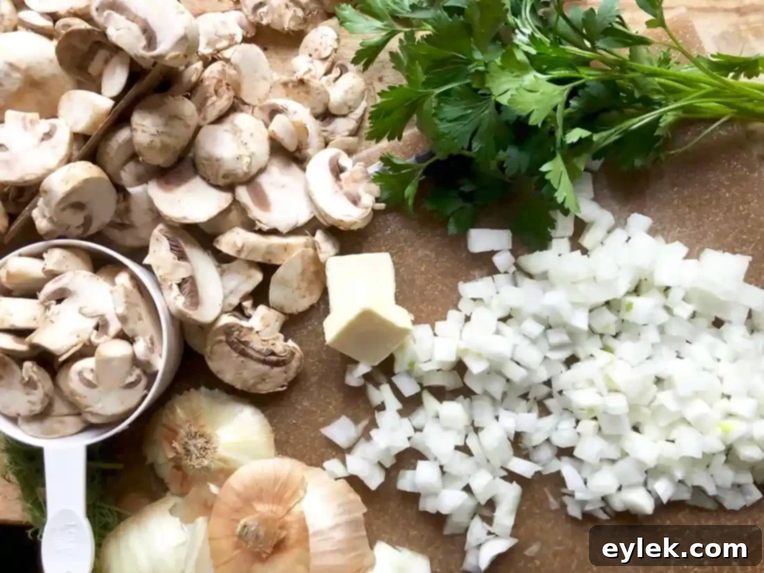 Sautéed onions and mushrooms in a large pot, cooking for the soup base.