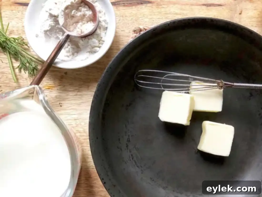 Preparing the roux: butter and flour whisked in a saucepan.