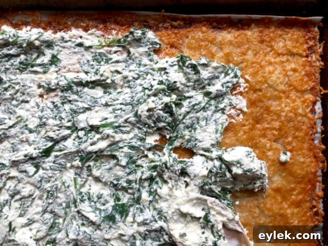 Beef-Filled Scalloped Potato Roulade 14 Spreading spinach ricotta mixture on the potato sheet