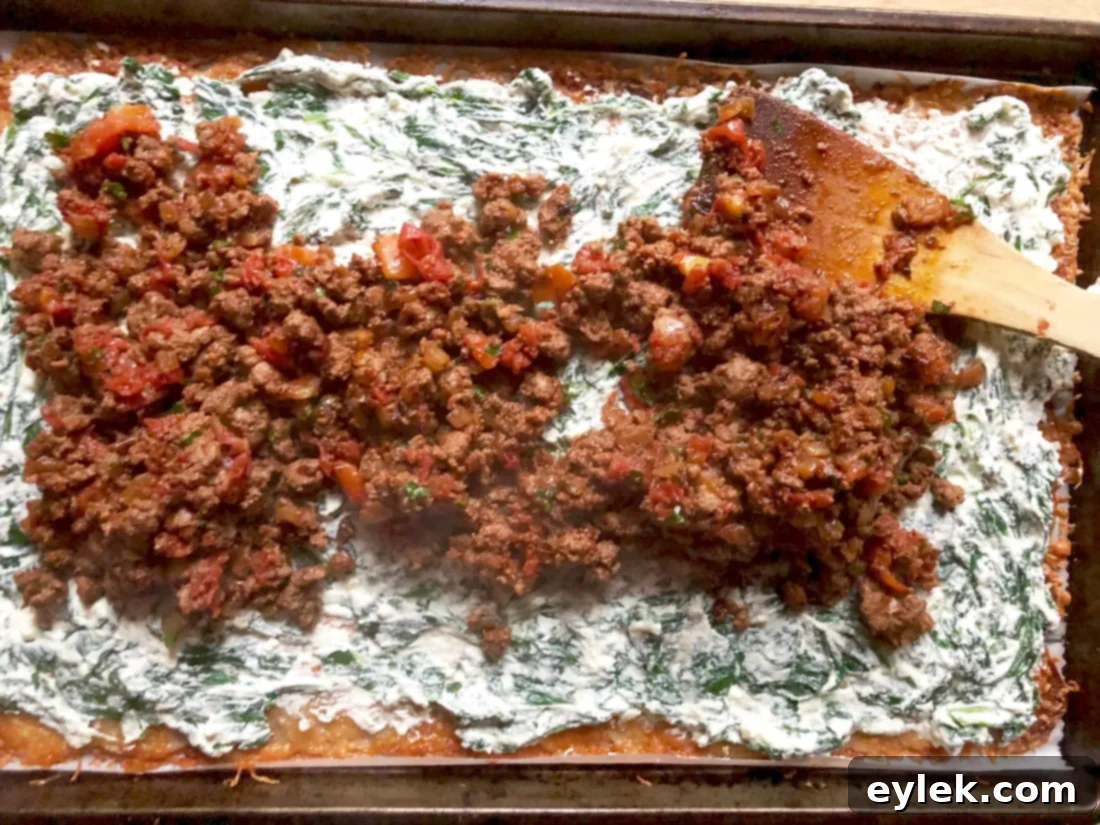 Beef-Filled Scalloped Potato Roulade 15 Beef filling spread over spinach layer on potato sheet