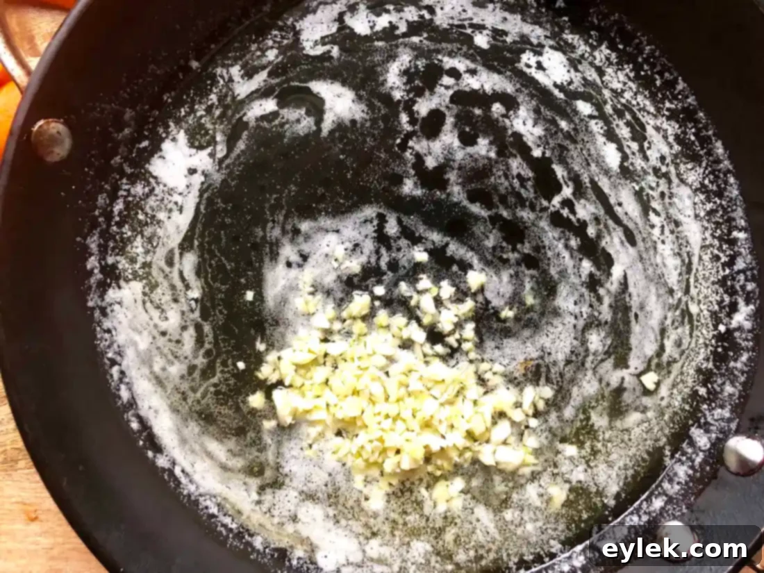 Tossing carrots in honey butter glaze