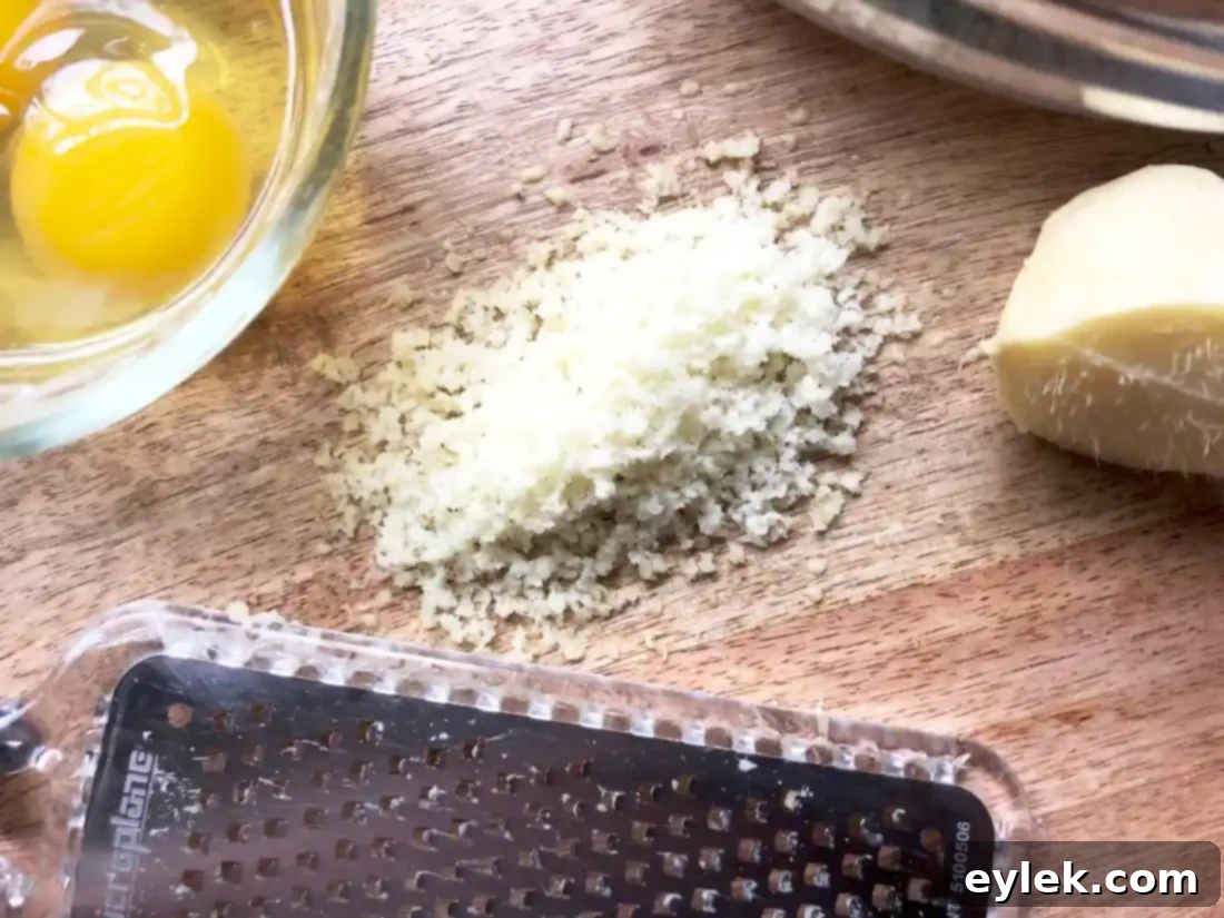 fresh ginger being grated for pumpkin bread