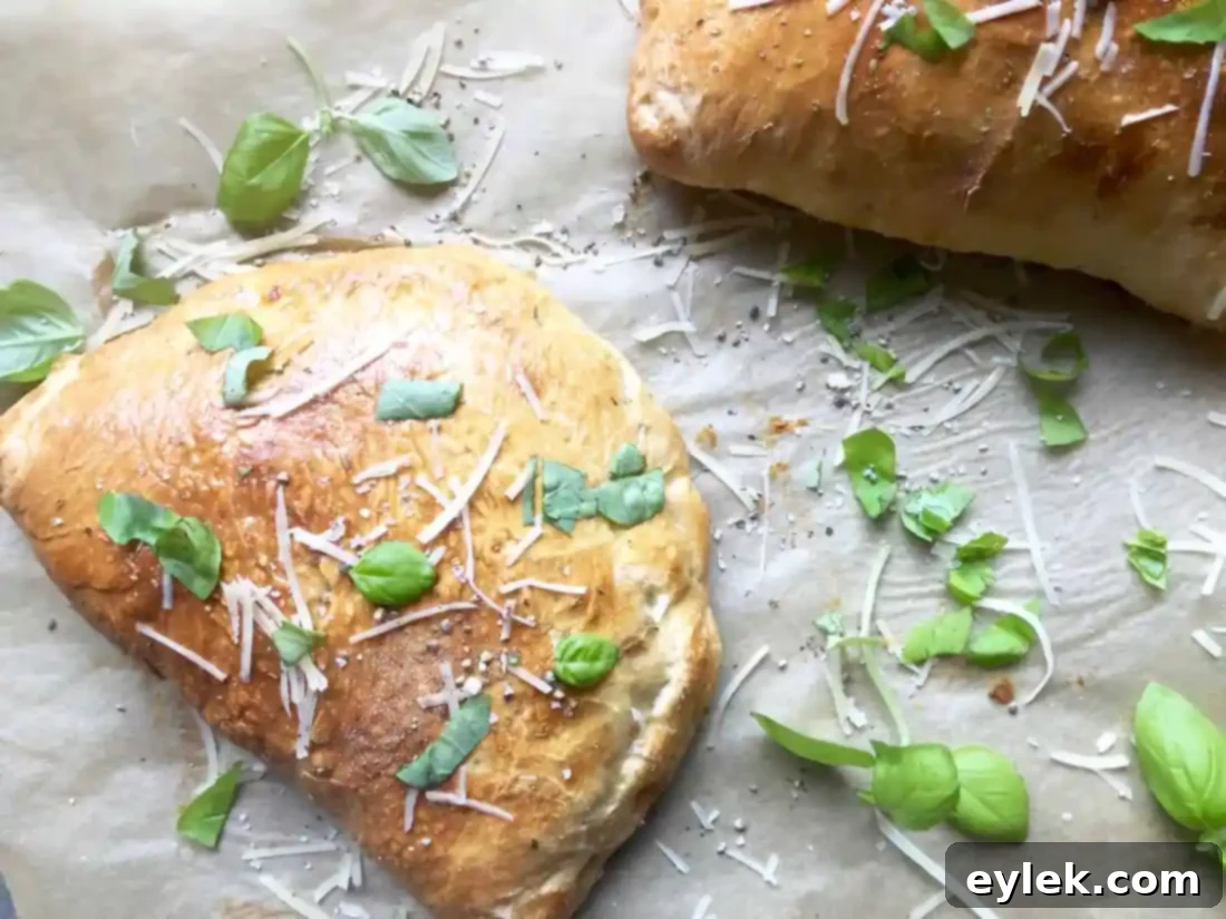 Slicing a baked chicken and mushroom calzone into wedges