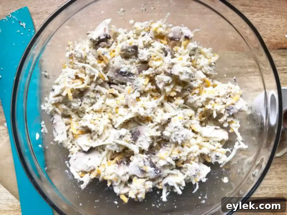 Shredded chicken and sliced mushrooms for calzone filling