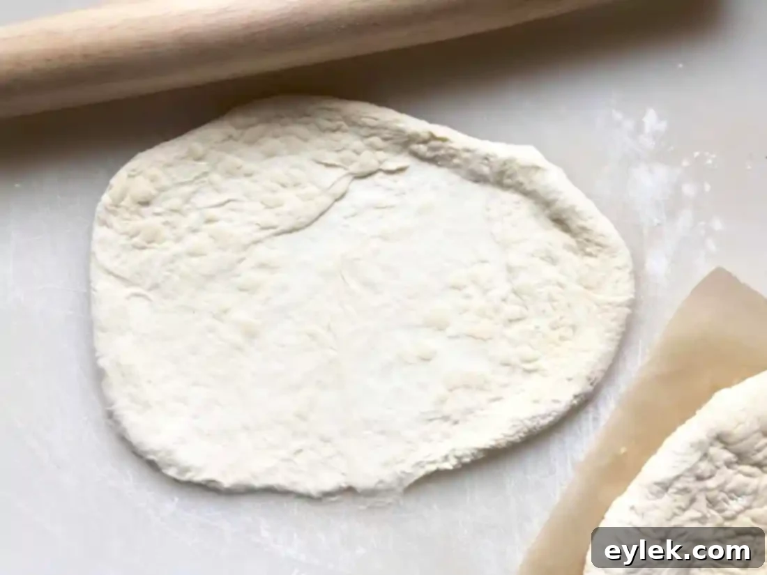 Calzone dough rolled out, ready for filling