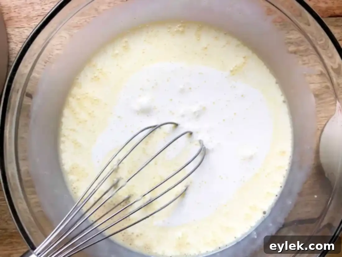 Bread soaking in custard mixture in the baking pan
