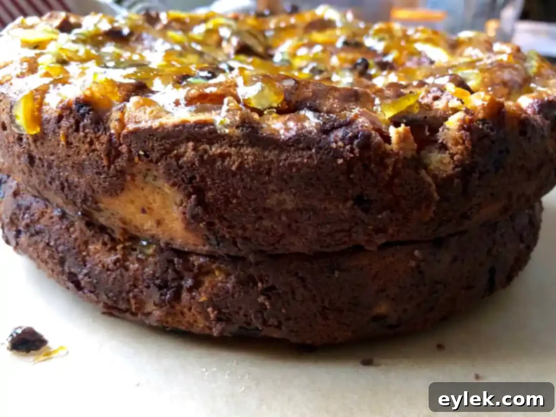 Side view of the stacked cinnamon raisin bread pudding with glaze