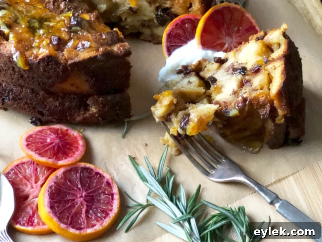 Top-down view of a garnished slice of cinnamon raisin bread pudding