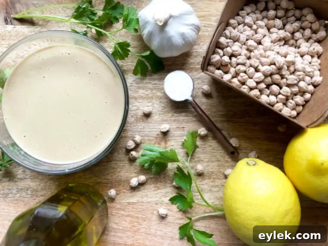Ottolenghi's creamy homemade hummus, garnished with olive oil