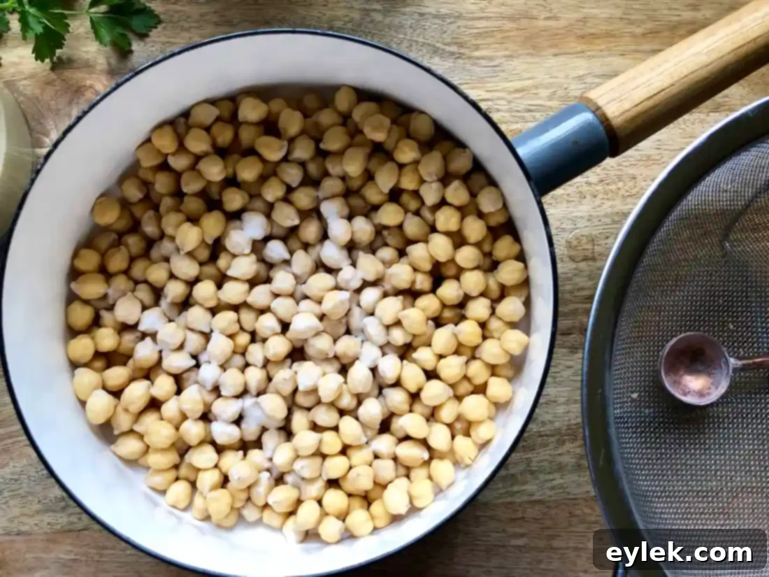 Chickpeas cooking with baking soda to loosen skins