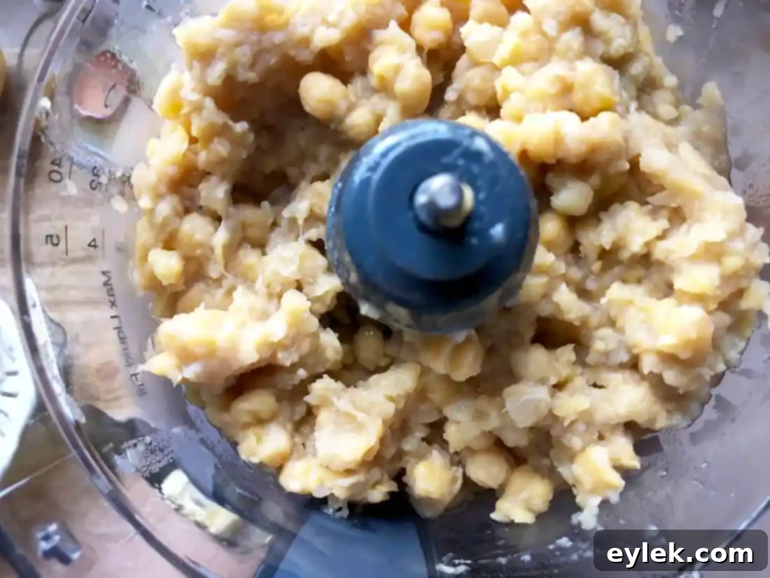 Ingredients for hummus in a food processor