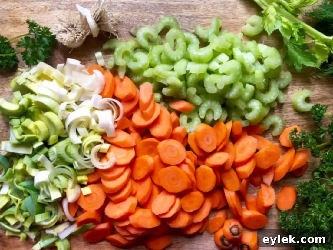 Freshly chopped carrots and celery ready for Super Quick Chicken Orzo Soup.