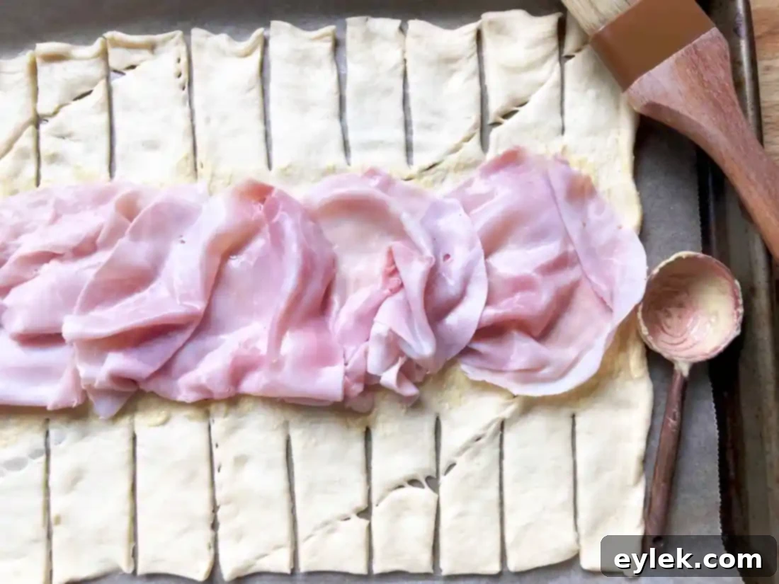 Layering ham on breakfast loaf