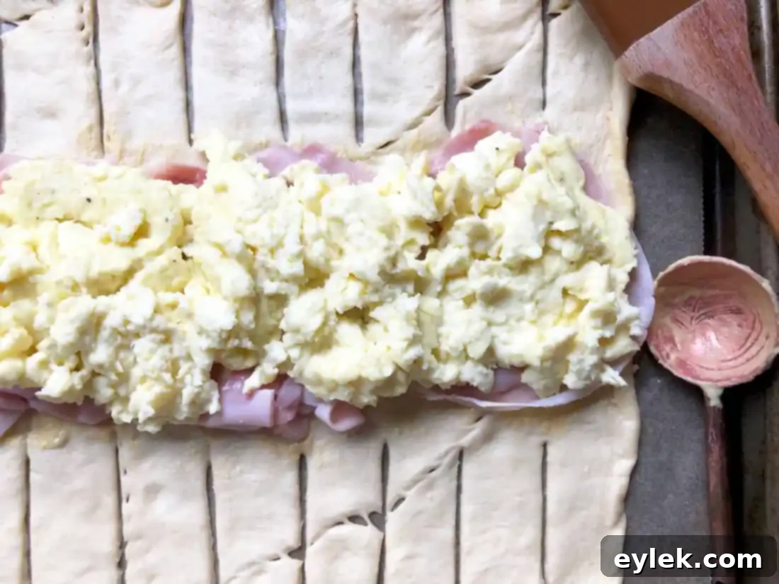 Adding scrambled eggs to the breakfast loaf