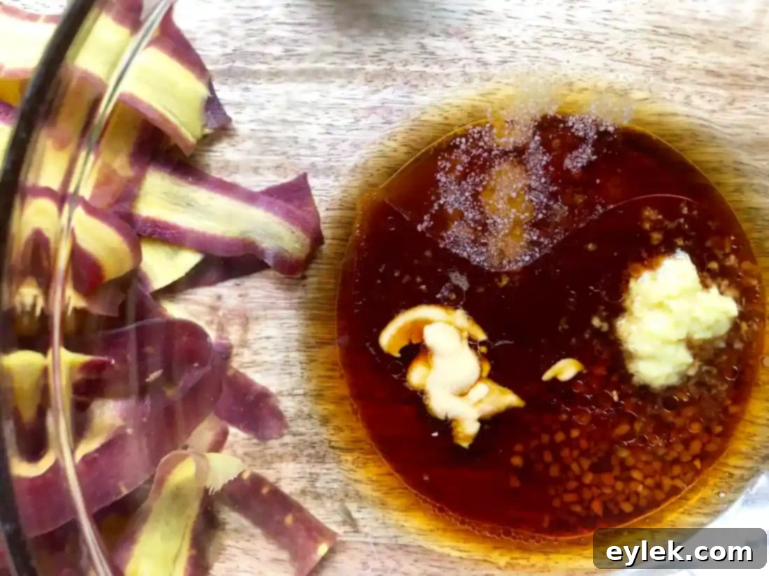 Bowl of freshly prepared dressing with grated ginger and other ingredients