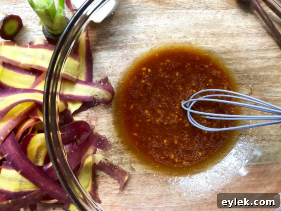 Purple carrot ribbons tossed in the savory dressing for the Soba Noodle Salad