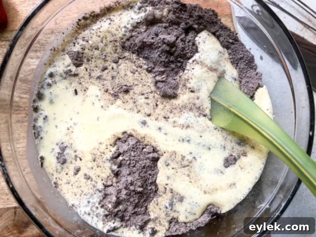 Combining cream mixture with dry ingredients for shortcake dough