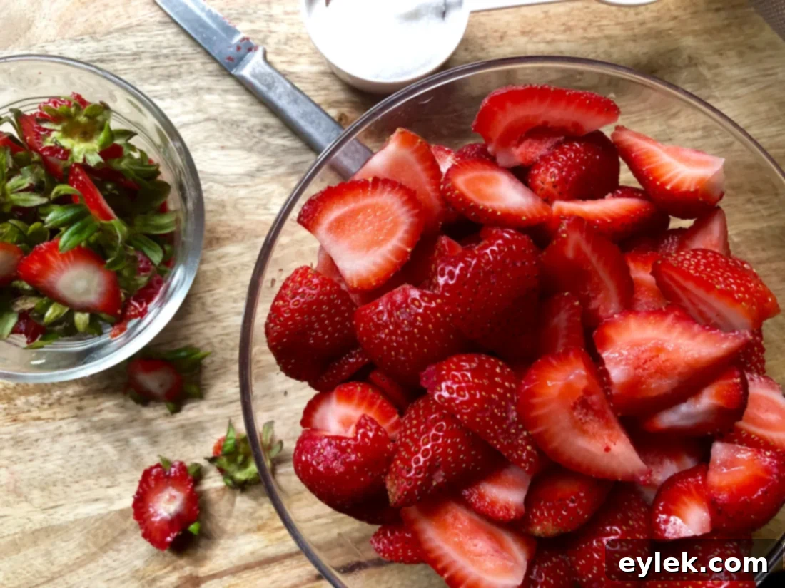 Mashed strawberries in a bowl for shortcake topping