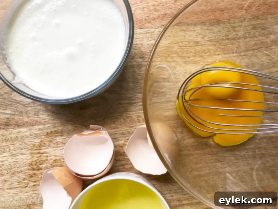 Whisking egg yolks and heavy cream for shortcakes