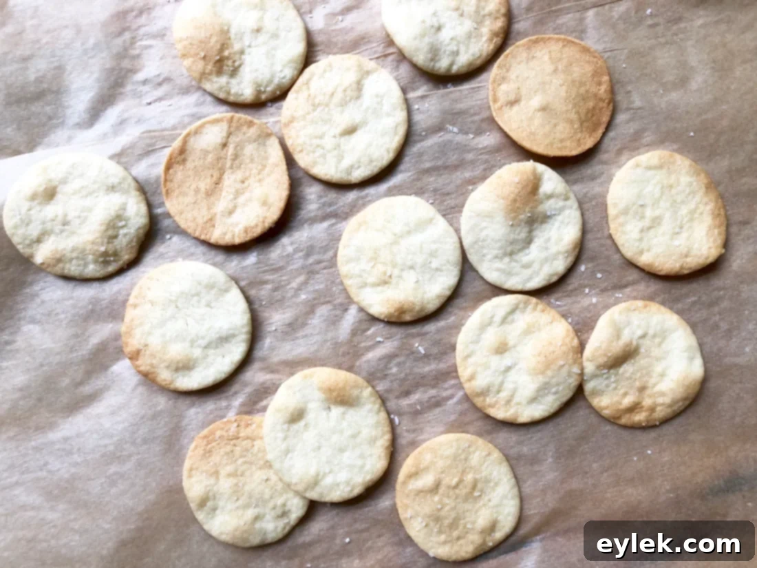 Einkorn cheese crackers baking in the oven on parchment paper