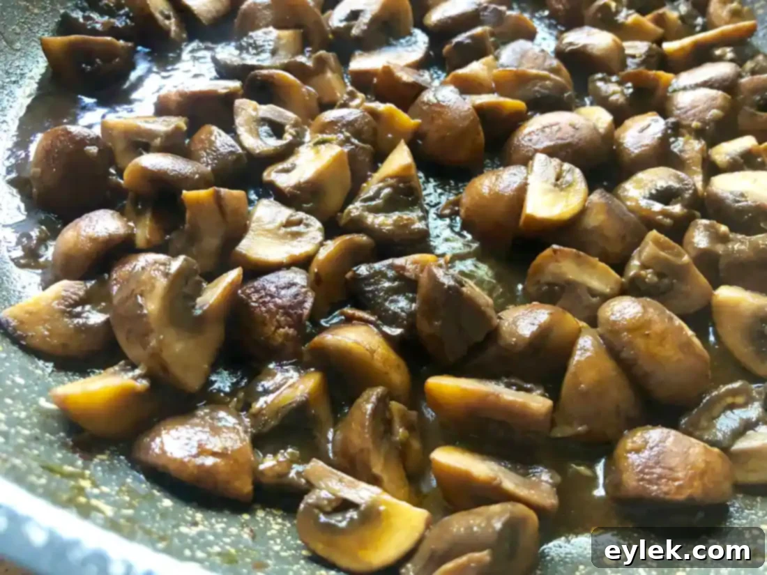 Pan with Marsala mushrooms, showing the reduced sauce coating.